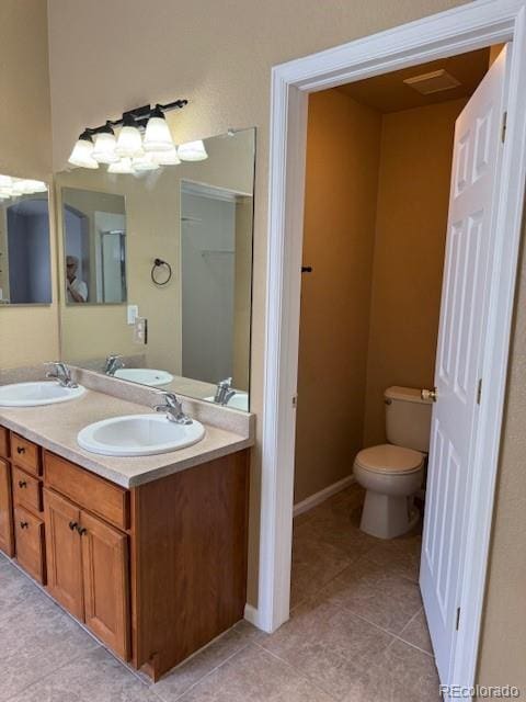 20148 E Dartmouth Dr, Aurora, CO 80013 - full bath featuring toilet, double vanity, and tile patterned floors