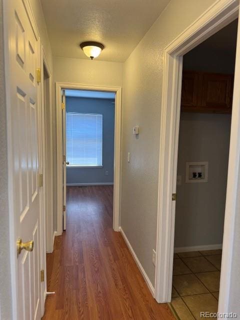 20148 E Dartmouth Dr, Aurora, CO 80013 - corridor with baseboards and wood finished floors