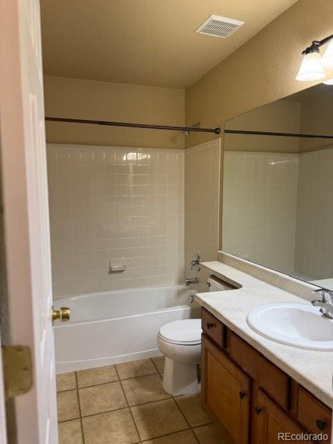 20148 E Dartmouth Dr, Aurora, CO 80013 - bathroom featuring vanity, washtub / shower combination, tile patterned floors, and toilet