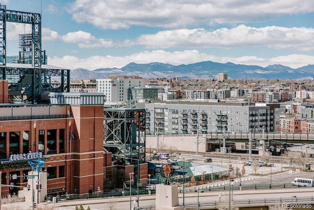 property's view of city with a mountain view