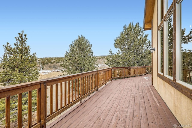 wooden terrace with a water view