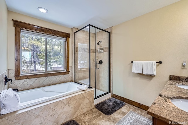 bathroom with vanity and plus walk in shower