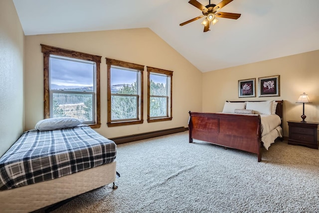 carpeted bedroom featuring vaulted ceiling, baseboard heating, and ceiling fan