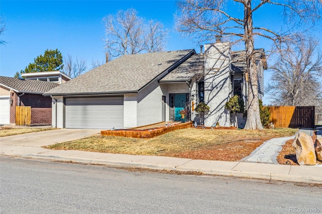 view of front of home with a garage, brick siding, fence, driveway, and roof with shingles