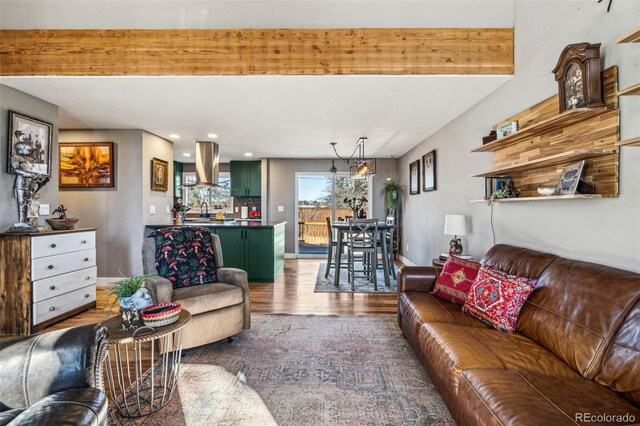 living area featuring recessed lighting, baseboards, and wood finished floors