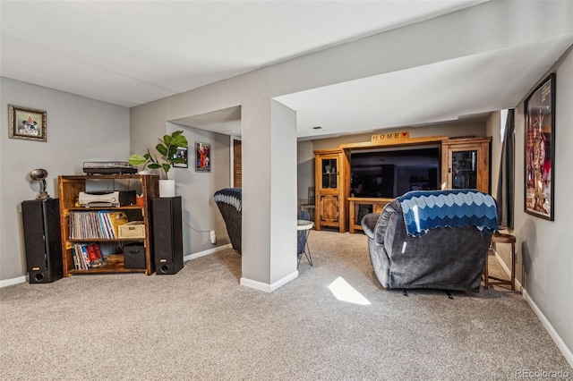 interior space featuring carpet floors and baseboards