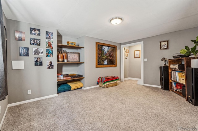 rec room featuring carpet and baseboards