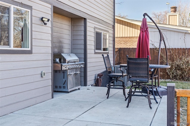 view of patio / terrace featuring fence and grilling area