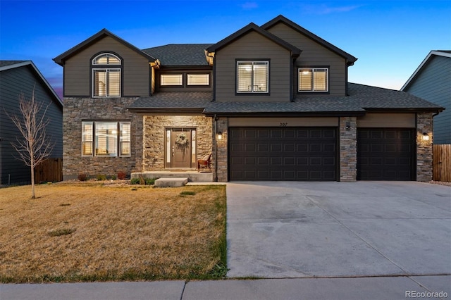 view of front facade featuring stone siding, driveway, and roof with shingles