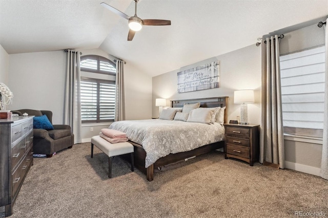 bedroom with baseboards, a textured ceiling, a ceiling fan, lofted ceiling, and light colored carpet