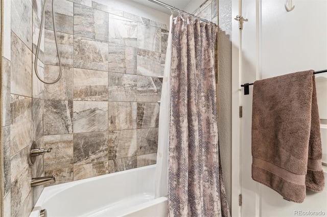bathroom featuring shower / bathtub combination with curtain