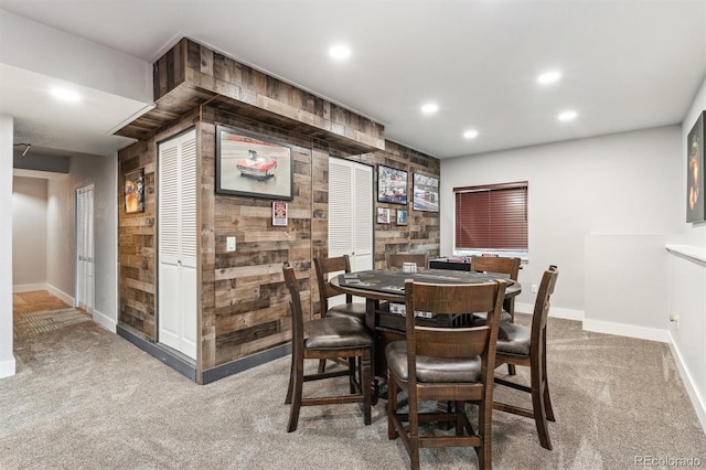 carpeted dining space with baseboards and recessed lighting