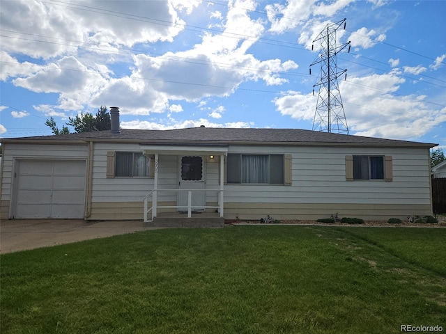 3905 Nelson St, Wheat Ridge, CO 80033 - ranch-style home with an attached garage, a front yard, and concrete driveway