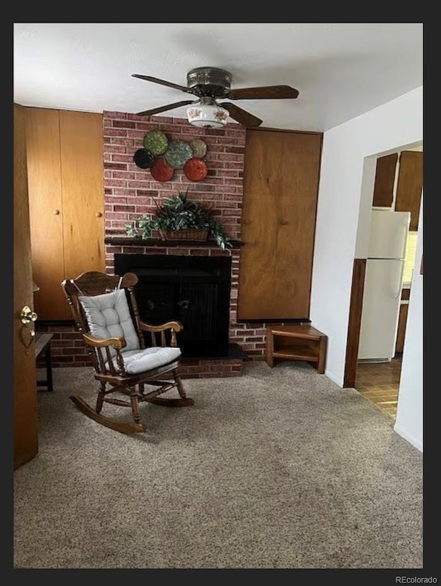 3905 Nelson St, Wheat Ridge, CO 80033 - living area with carpet flooring, a ceiling fan, and a fireplace