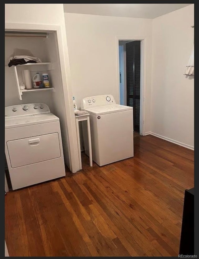 3905 Nelson St, Wheat Ridge, CO 80033 - washroom with dark wood finished floors and washing machine and clothes dryer