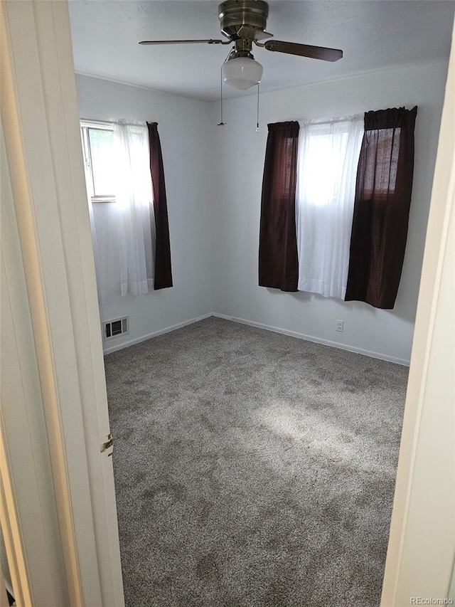 3905 Nelson St, Wheat Ridge, CO 80033 - spare room with a ceiling fan, carpet flooring, and baseboards