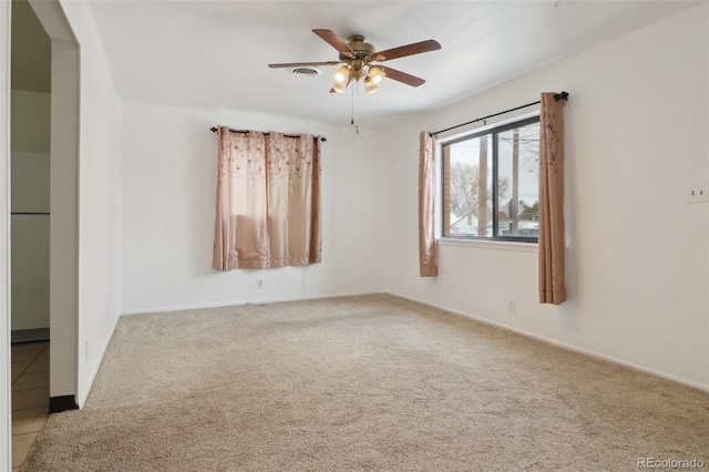 unfurnished room with light carpet and ceiling fan