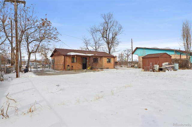 view of snow covered house