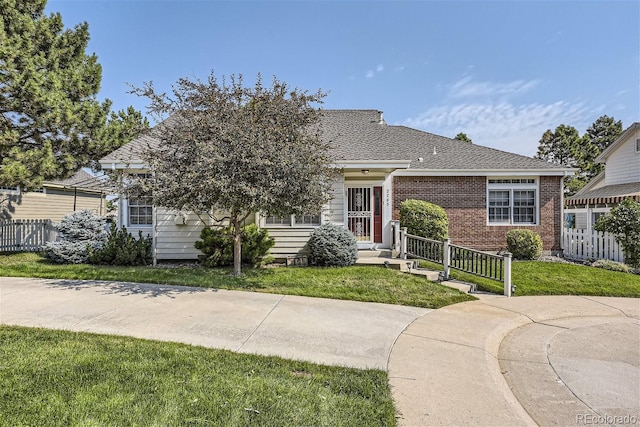 2265 S Depew St, Denver, CO 80227 - view of front of property with brick siding and roof with shingles