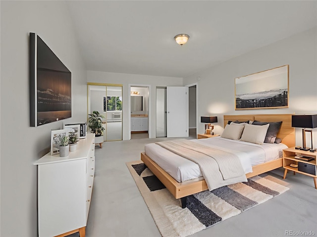 3144 S Wheeling Way Unit 206, Aurora, CO 80014 - bedroom featuring finished concrete floors and connected bathroom
