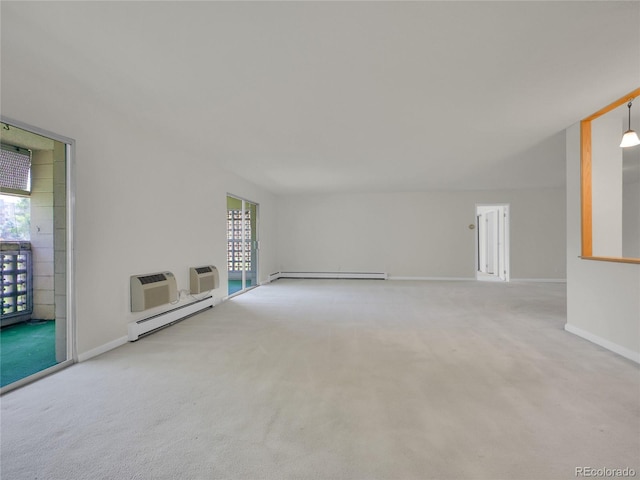 3144 S Wheeling Way Unit 206, Aurora, CO 80014 - unfurnished living room with a baseboard radiator, baseboard heating, carpet flooring, and a wall mounted AC