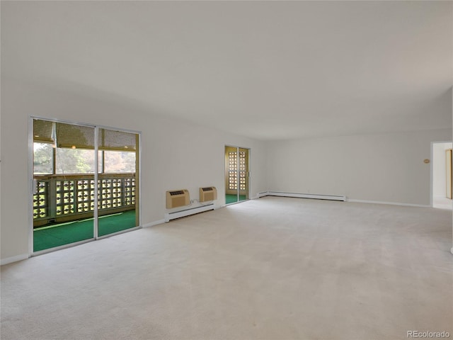 3144 S Wheeling Way Unit 206, Aurora, CO 80014 - unfurnished living room featuring a baseboard radiator, carpet flooring, a wall mounted air conditioner, and baseboard heating
