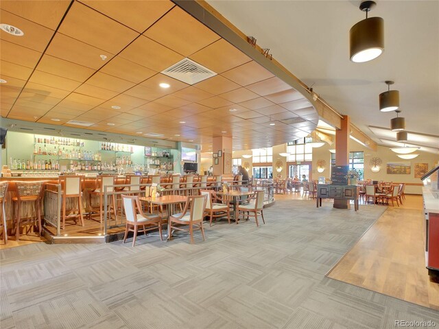 3144 S Wheeling Way Unit 206, Aurora, CO 80014 - dining space featuring carpet flooring and a community bar