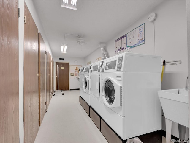 3144 S Wheeling Way Unit 206, Aurora, CO 80014 - shared laundry room featuring separate washer and dryer