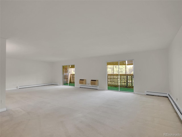 3144 S Wheeling Way Unit 206, Aurora, CO 80014 - unfurnished living room featuring a baseboard radiator and carpet floors