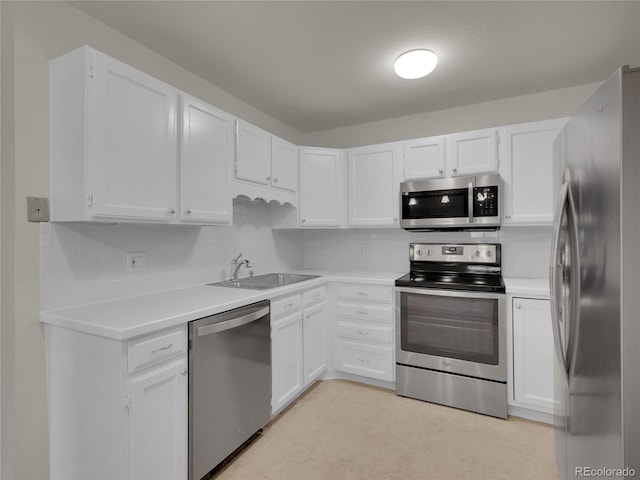 3144 S Wheeling Way Unit 206, Aurora, CO 80014 - kitchen featuring stainless steel appliances, white cabinetry, and light countertops