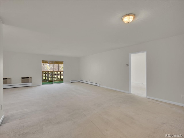 3144 S Wheeling Way Unit 206, Aurora, CO 80014 - unfurnished living room featuring a baseboard radiator, a baseboard heating unit, light colored carpet, and a wall mounted AC
