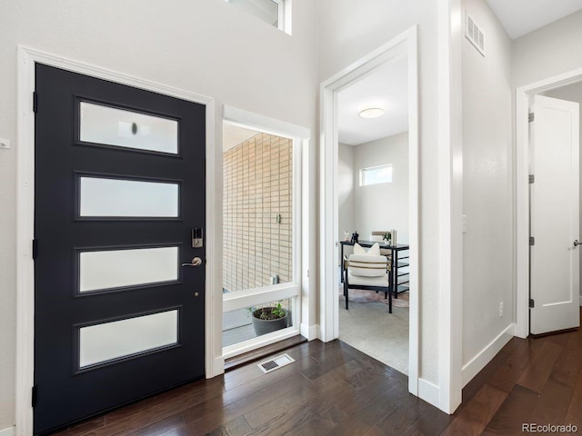 6096 W Keene Ave, Denver, CO 80235 - entrance foyer featuring dark wood-type flooring and baseboards