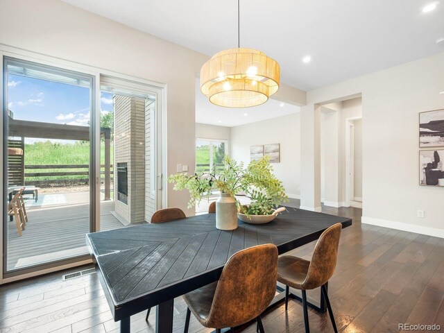 6096 W Keene Ave, Denver, CO 80235 - dining space with wood finished floors, recessed lighting, and a chandelier