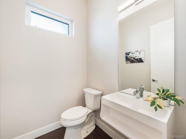 6096 W Keene Ave, Denver, CO 80235 - half bath with wood finished floors and vanity