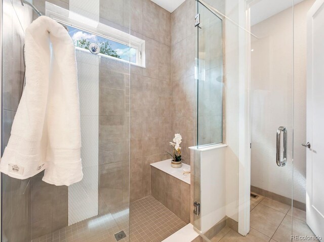 6096 W Keene Ave, Denver, CO 80235 - full bathroom featuring a shower stall and tile patterned floors
