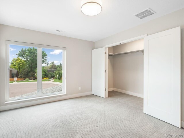 6096 W Keene Ave, Denver, CO 80235 - unfurnished bedroom with light carpet and a closet