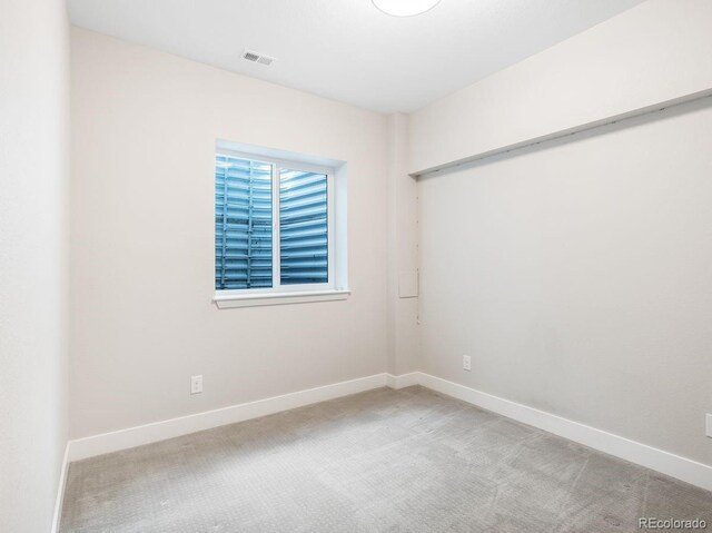6096 W Keene Ave, Denver, CO 80235 - carpeted empty room featuring baseboards