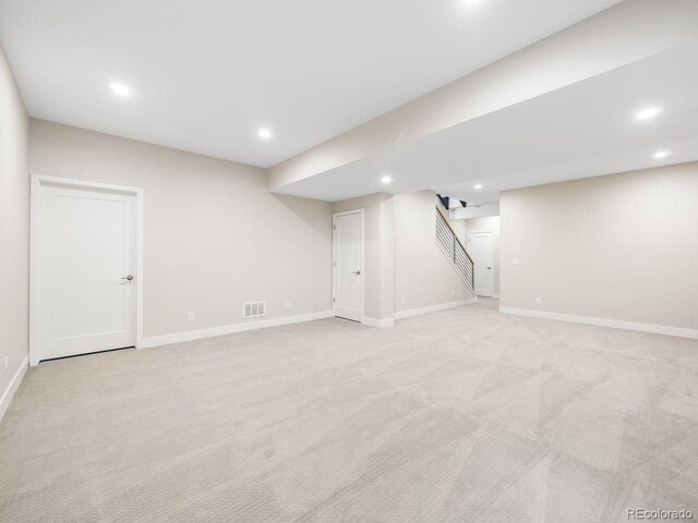 6096 W Keene Ave, Denver, CO 80235 - finished below grade area featuring recessed lighting, stairway, and light carpet
