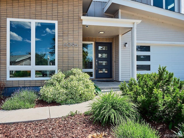 6096 W Keene Ave, Denver, CO 80235 - property entrance featuring a garage