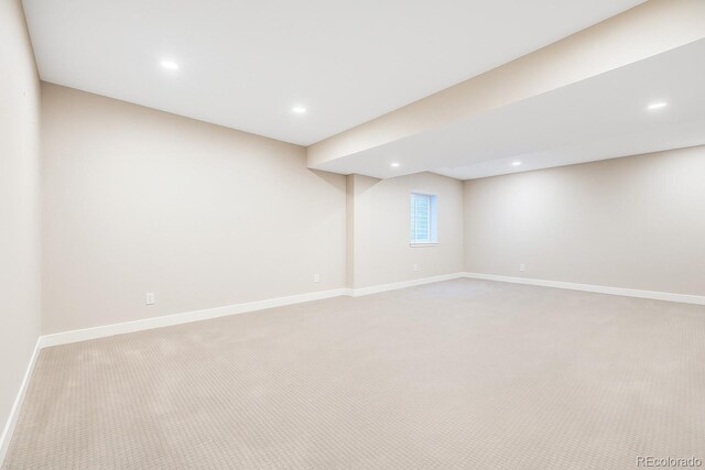 6096 W Keene Ave, Denver, CO 80235 - below grade area with light colored carpet and recessed lighting