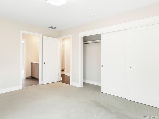 6096 W Keene Ave, Denver, CO 80235 - unfurnished bedroom with carpet floors and a closet