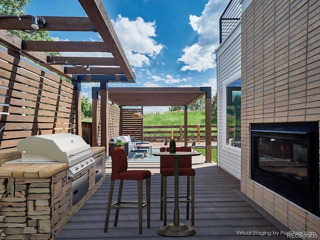 6096 W Keene Ave, Denver, CO 80235 - wooden terrace with a brick fireplace, a pergola, and a grill
