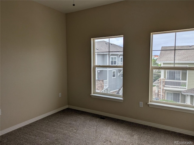 9578 Pearl Cir Unit 105, Parker, CO 80134 - carpeted empty room featuring baseboards