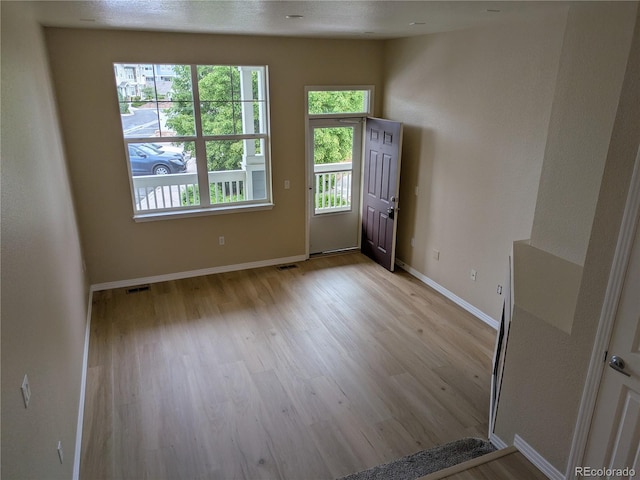 9578 Pearl Cir Unit 105, Parker, CO 80134 - entrance foyer featuring light wood-style floors and baseboards