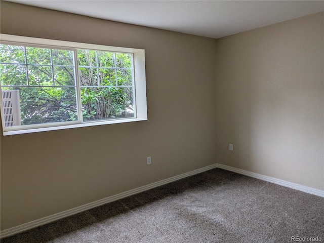 9578 Pearl Cir Unit 105, Parker, CO 80134 - empty room featuring baseboards and carpet flooring