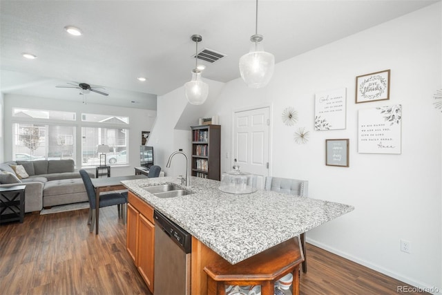 kitchen with a sink, stainless steel dishwasher, dark wood-type flooring, pendant lighting, and a ceiling fan