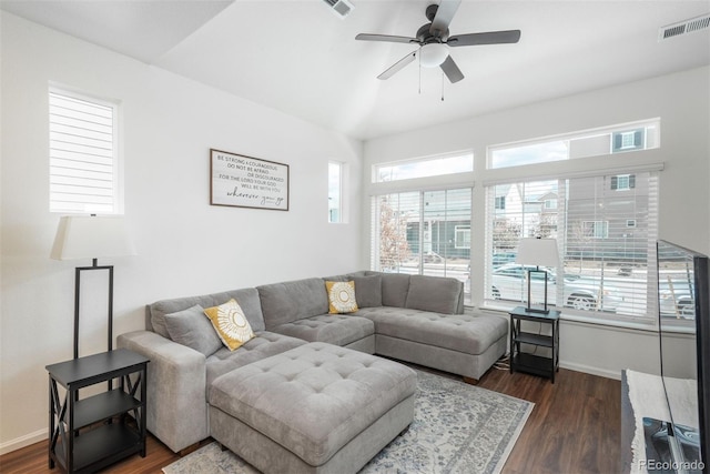 living room with baseboards, dark wood-style floors, and ceiling fan