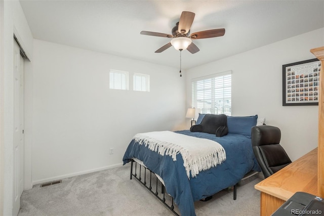 bedroom with carpet flooring, a closet, baseboards, and ceiling fan