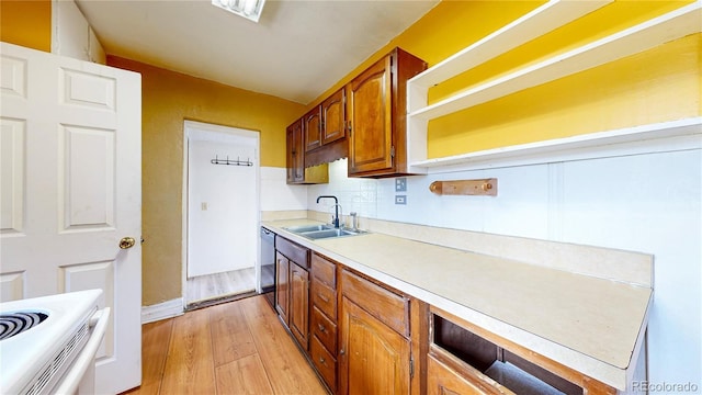 598 S Navajo St, Denver, CO 80223 - kitchen with light countertops, light wood-type flooring, brown cabinetry, tasteful backsplash, and dishwashing machine