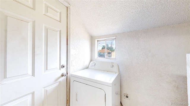 598 S Navajo St, Denver, CO 80223 - laundry area featuring washer / dryer, a textured ceiling, and a textured wall